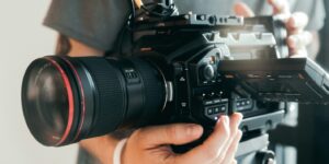 person holding black dslr camera