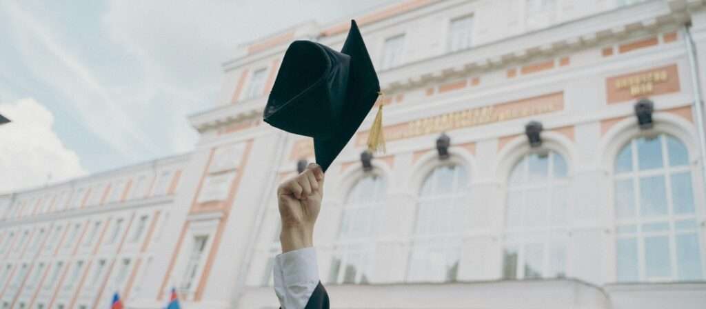 a person holding a black umbrella