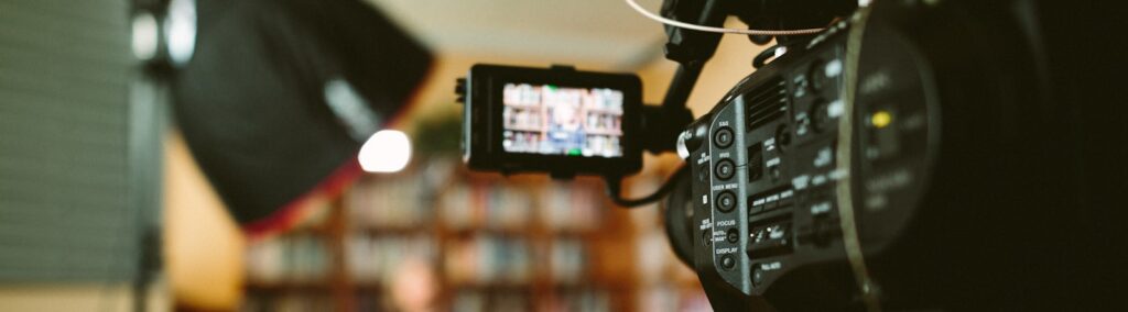 person sitting in front bookshelf