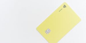 yellow square card on white surface